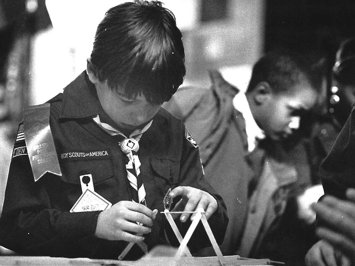 Benoit Lamairesse, 7 and member of Cub Scout Pack 3, builds a Popsicle stick and kebab skewer bridge on Feb. 27, 1993, at a 40-booth event showcasing the activities of the Greenwich Council of the Boy Scouts of America.