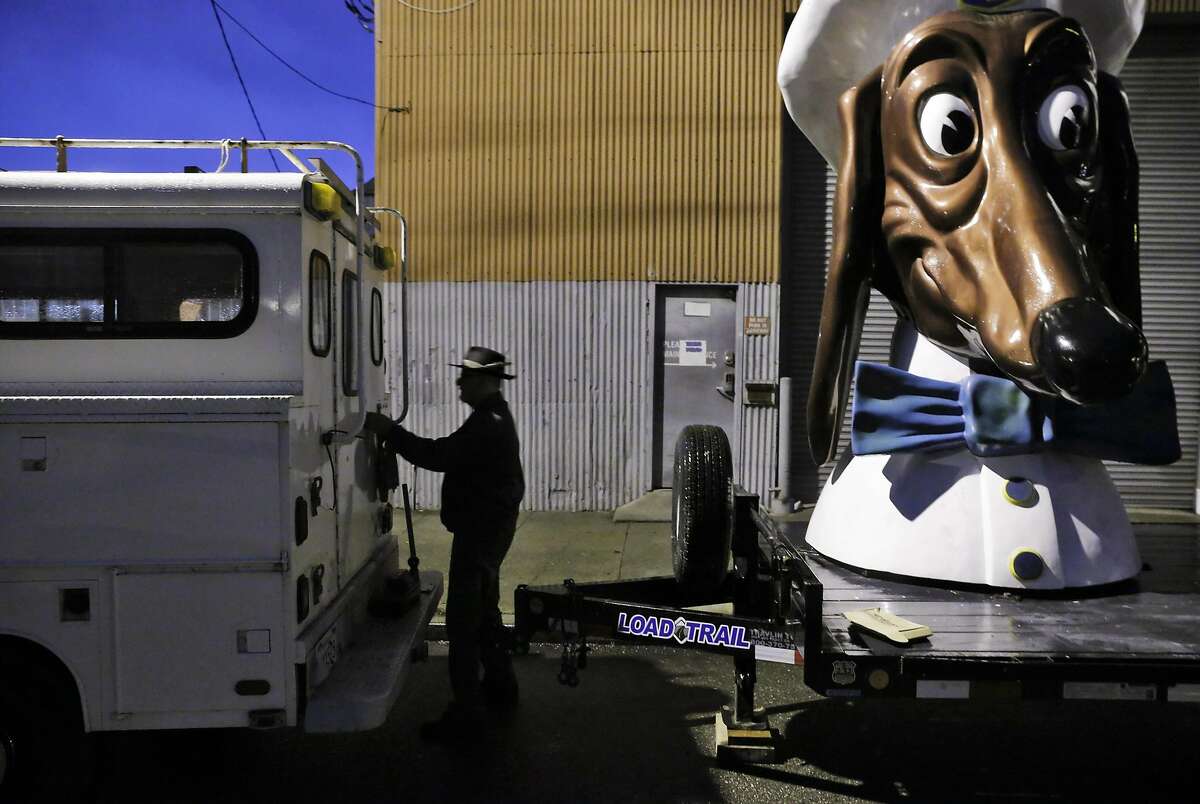 Artist John Law has placed his three restored Doggie Diner Dog Heads outside the Cycleside Swearhouse where he and other resident artist are protesting potentially losing their home in San Francisco, Calif., on Wednesday, December 14, 2016. The Cyclecide Swearhouse has been a hub for what's left of San Francisco's underground arts and maker scenes. After a dispute with their landlord, the artists, most of whom used it just as a workspace and event venue, reached a settlement extending their lease through May. But on the Monday after the Ghost Ship fire, inspectors showed up, and now it appears their landlord is using the tragedy as an excuse to push them out immediately.