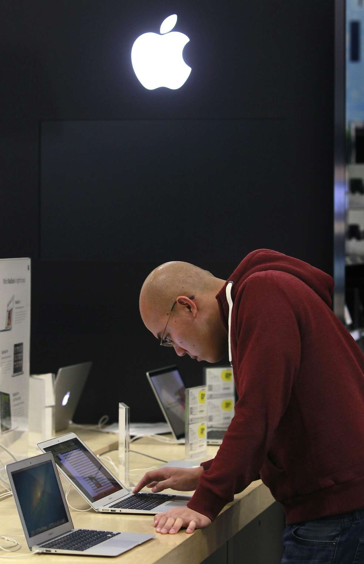 Alex Leong shops for a laptop computer during a lull in the Black Friday shopping rush at Best Buy in Oakland, Calif. on Friday, Nov. 23, 2012. Leong got to Best Buy at 3:30 a.m. after starting his shopping excursion at 9 p.m. Thursday in Livermore.