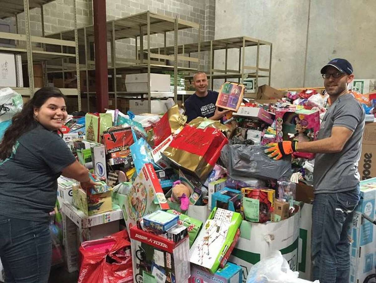 Volunteers sort donated gifts at the Be A Resource warehouse. (Courtesy of Texas DFPS)