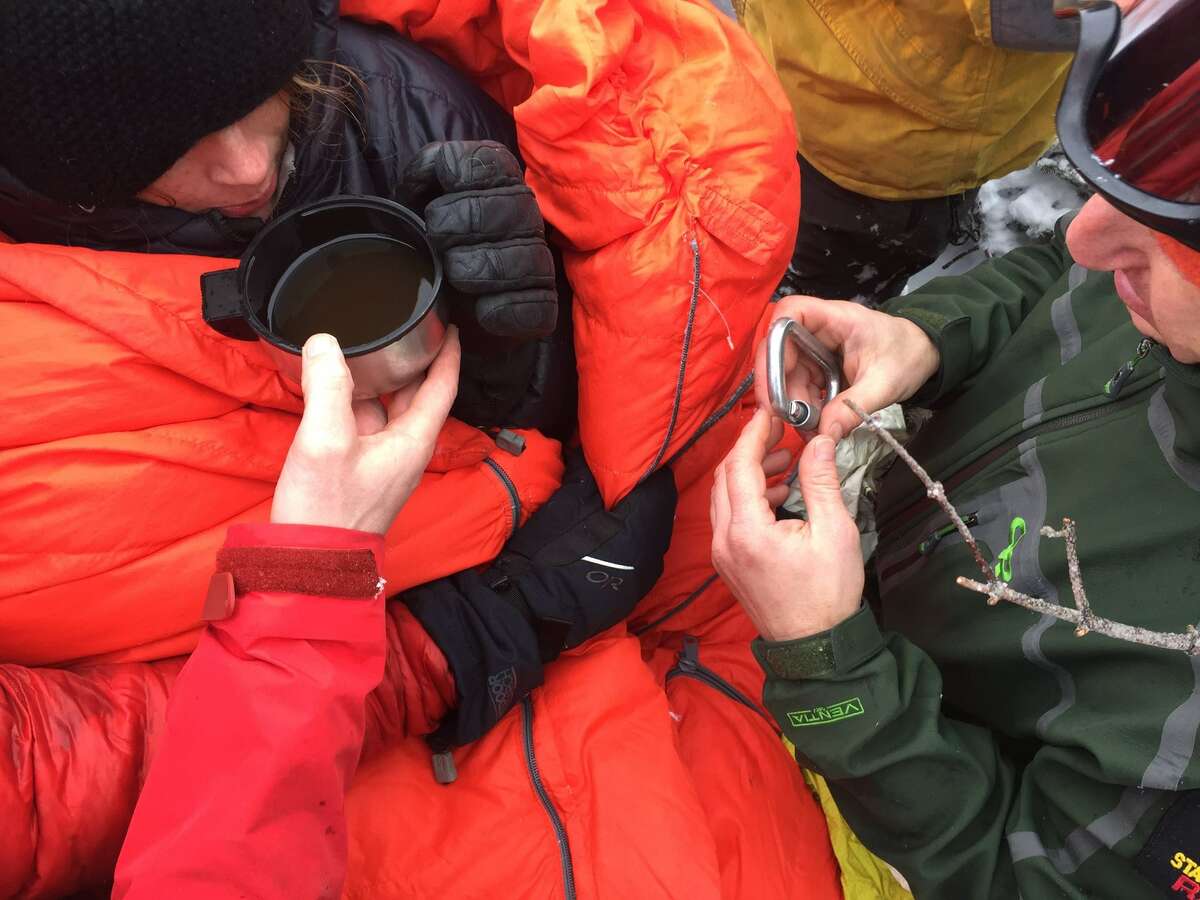 Lost hiker Maddie Popolizio drinks warm liquid after being found by rescue crews Dec. 13, 2016 on the Alonquin Peak. (New York State Department of Environmental Conservation) ORG XMIT: wXq0f2lCEog2LK96usx3