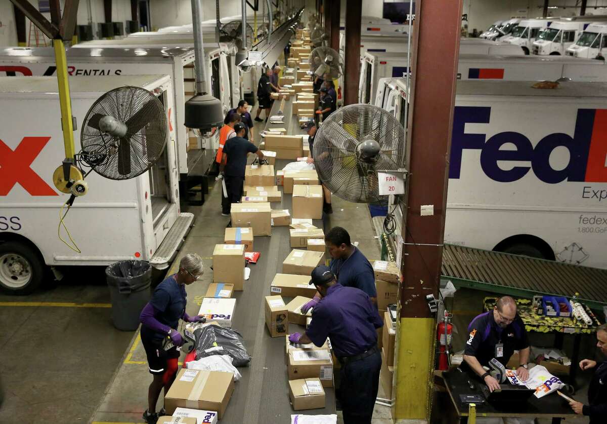 FedEx workers race to meet record demand