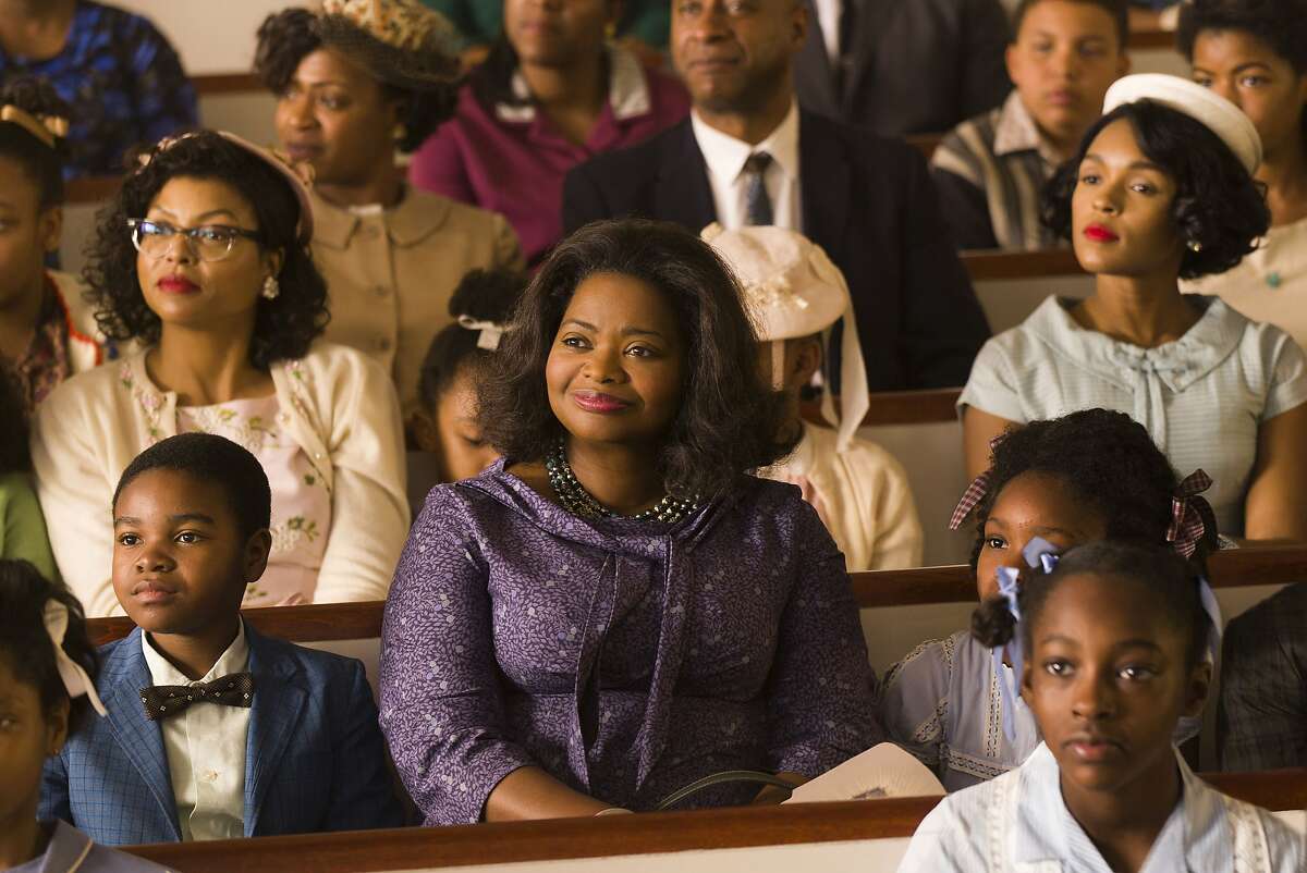 This image released by Twentieth Century Fox shows Taraji P. Henson, background left, Octavia Spencer, center, and Janelle Monae, background right, in a scene from "Hidden Figures." Spencer was nominated for a Golden Globe award for best supporting actress for her role in the film on Monday, Dec. 12, 2016. The 74th Golden Globe Awards ceremony will be broadcast on Jan. 8, on NBC. (Hopper Stone/Twentieth Century Fox via AP)