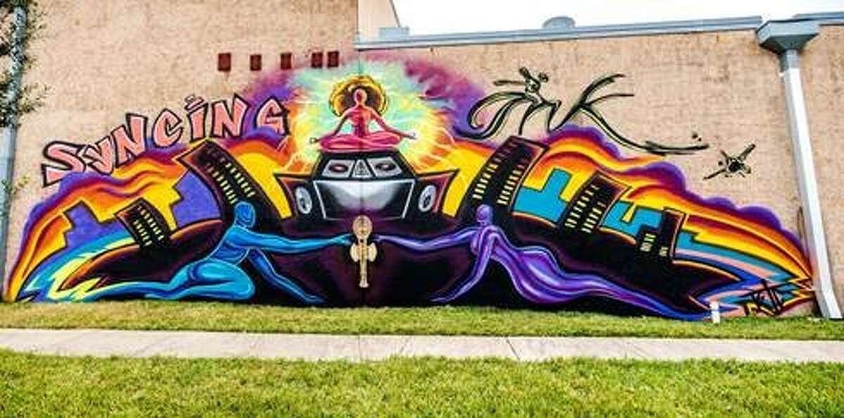 The Alley Theatre commissioned Brionya James to create the "Syncing Ink" mural near the corner of Crawford and Bagby to promote its world premiere of a hip-hop musical.