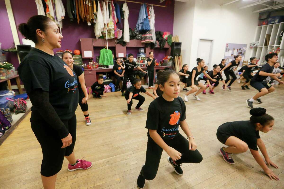 Dance Director Jeannette Chavez (left) watches as the Folklorico I dance class rehearses for an upcoming performance at the Galeria Guadalupe, 723 S. Brazos, on Thursday, Nov. 17, 2016. MARVIN PFEIFFER/ mpfeiffer@express-news.net