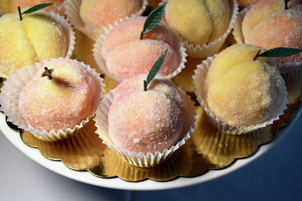 La Pesca cream-filled cookies rolled in sugar and dipped in Peach Schnapps at Cafe Calabria in Guilderland. The restaurant is closing at the end of the month.
