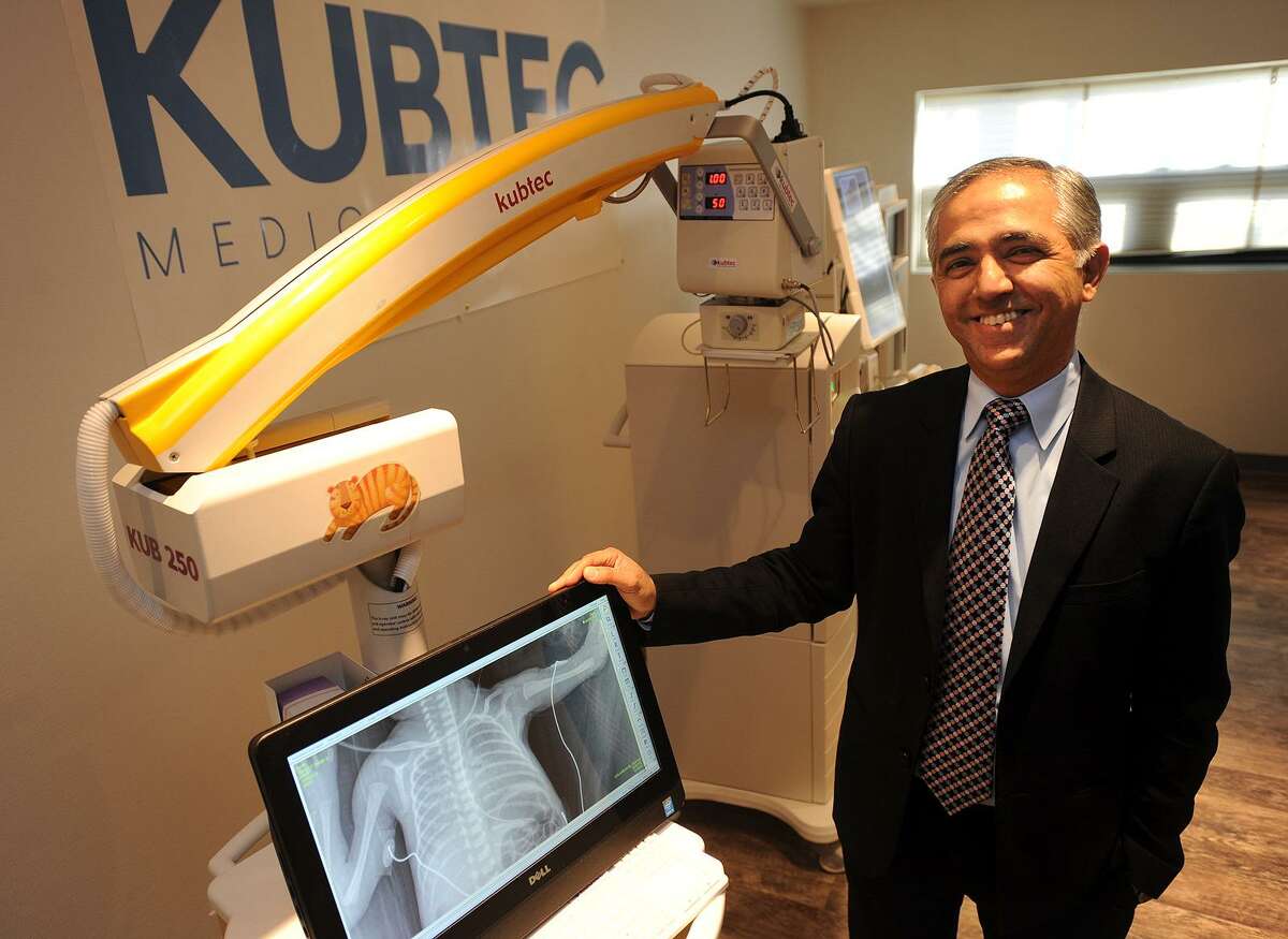 Kubtec CEO Vikram Butani with his company's KUB 250 neonatal imaging system at the company's new headquarters in Stratford, Conn. on Wednesday, December 14, 2016. The unit, which is used to x-ray premature babies, uses the lowest dose of radiation of any system.