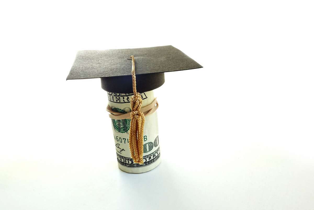Mini graduation cap on a roll of cash