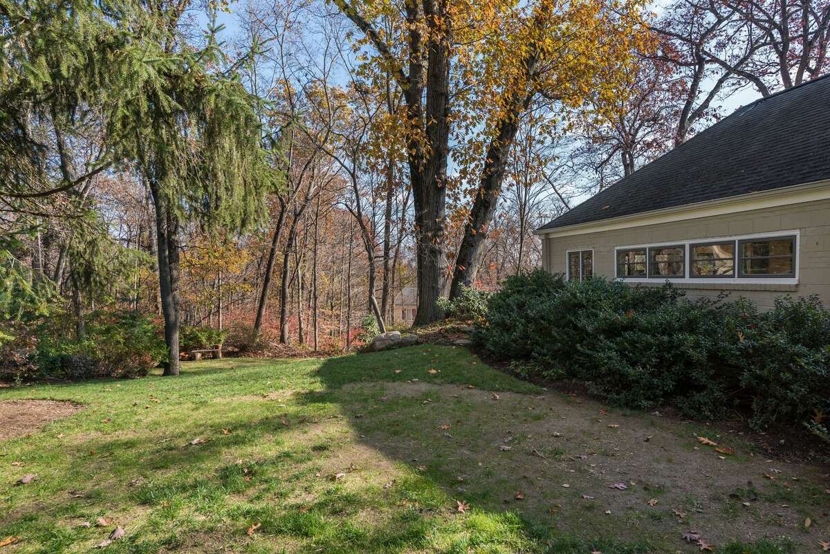 North Stamford log cabin home offers rustic charm