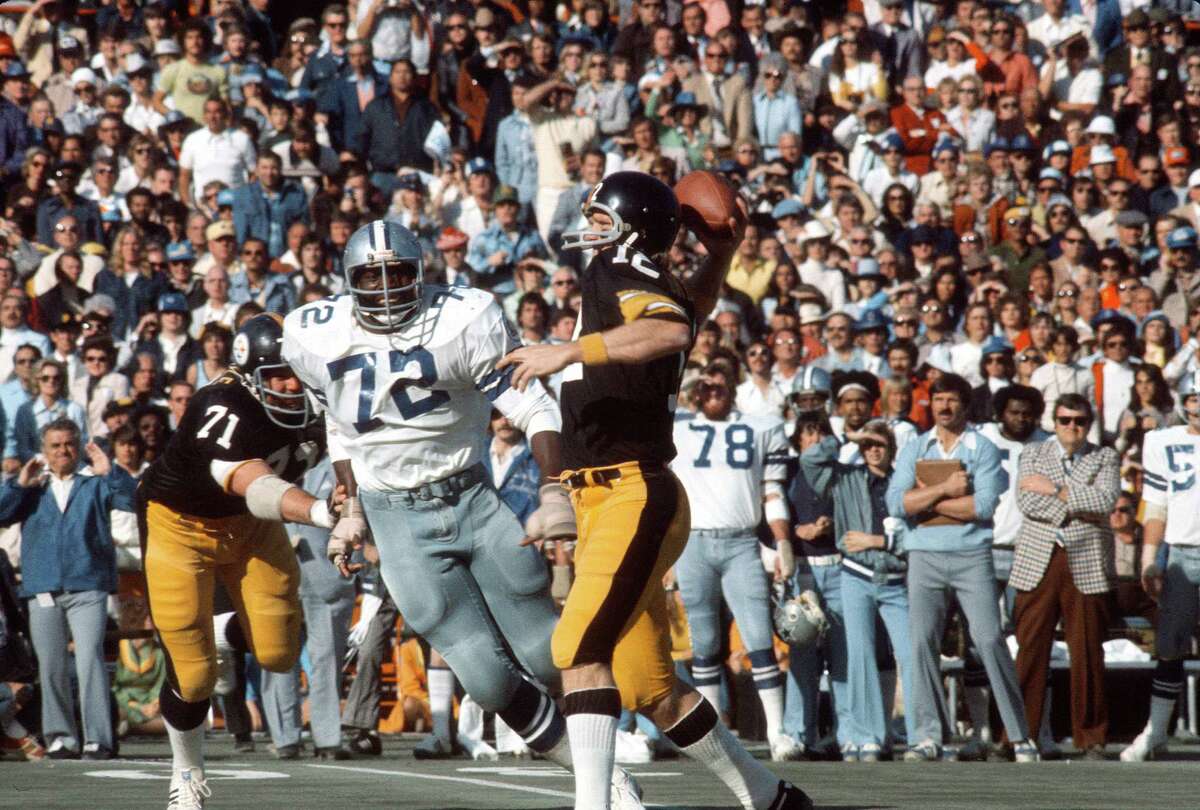 Pittsburgh Steelers quarterback Terry Bradshaw (12) tosses ball to official  signaling touchdown after Bradshaw scored to tie score in AFC Game against  Denver Broncos in Denver on Saturday, Dec. 24, 1977. Denver's