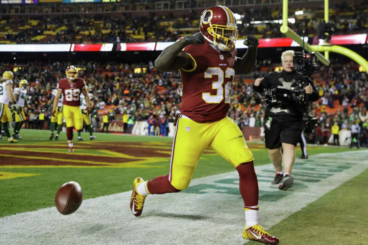 FILE - In this Nov. 20, 2016, file photo, Washington Redskins running back Rob Kelley (32) celebrates his touchdown during the second half of an NFL football game against the Green Bay Packers, in Landover, Md. The surprising success by such low-profile rushers as Jay Ajayi, Jordan Howard, Robert Kelley and Tim Hightower speaks to the challenge of evaluating running backs _ and the high injury rate at the position. (AP Photo/Patrick Semansky, File)