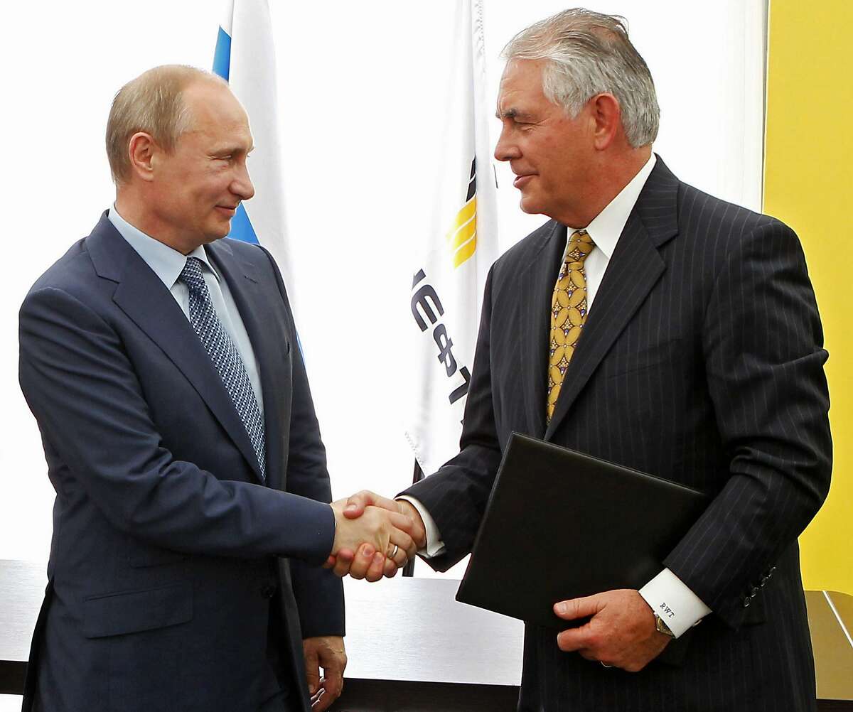 FILE- In this June 15, 2012, file photo, Russian President Vladimir Putin, left, and ExxonMobil CEO Rex Tillerson, now secretary of state-designate, shake hands at a signing ceremony of an agreement between state-controlled Russian oil company Rosneft and ExxonMobil at the Black Sea port of Tuapse, southern Russia. If there’s one thing Republicans and Democrats have agreed on in foreign policy, it is the power of sanctions. Both have levied economic penalties on foreign governments, pressuring Iran into nuclear concessions or Myanmar into democratic reform. But Donald Trump’s choice for secretary of state has seen things differently. (Mikhail Klimentyev/RIA-Novosti, Presidential Press Service via AP, Pool, File)