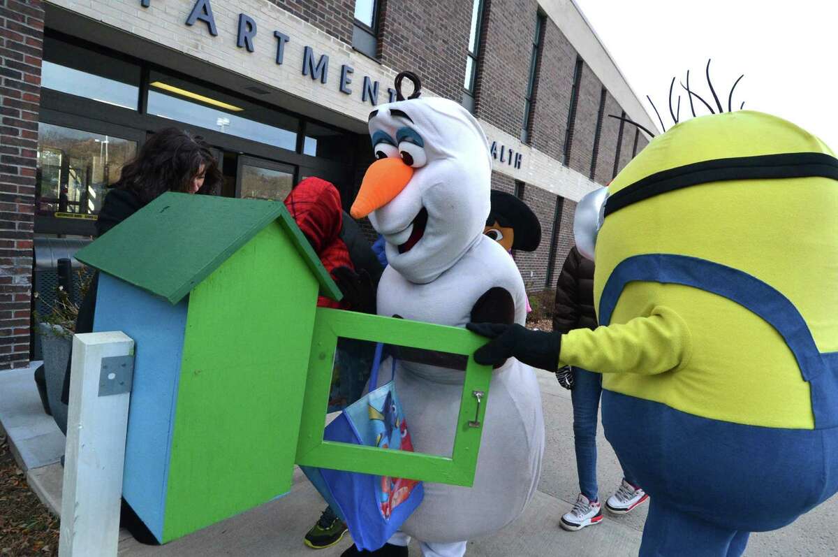 The Connecticut Parents Union bus tour stops at Norwalk City Hall on Thursday to promote its annual ”Tis’ the Season” to be reading event, and with help from Olaf, Minion and Dora the Explorer.