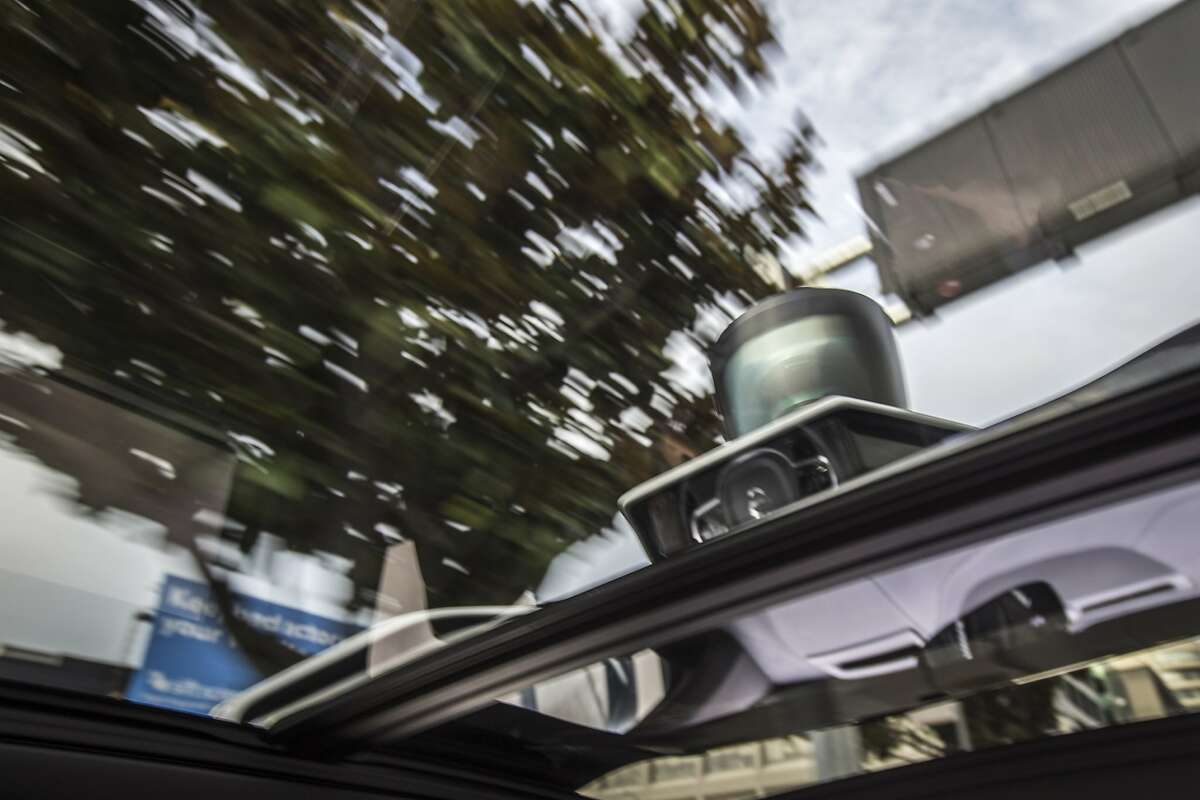 The spinning LIDAR system is seen on top of the roof of Uber's self-driving Volvo XC90 SUV during a test drive in downtown San Francisco on Tuesday, Dec. 13, 2016 in San Francisco, Calif. The LIDAR builds a 3D view of the car's surrounding.