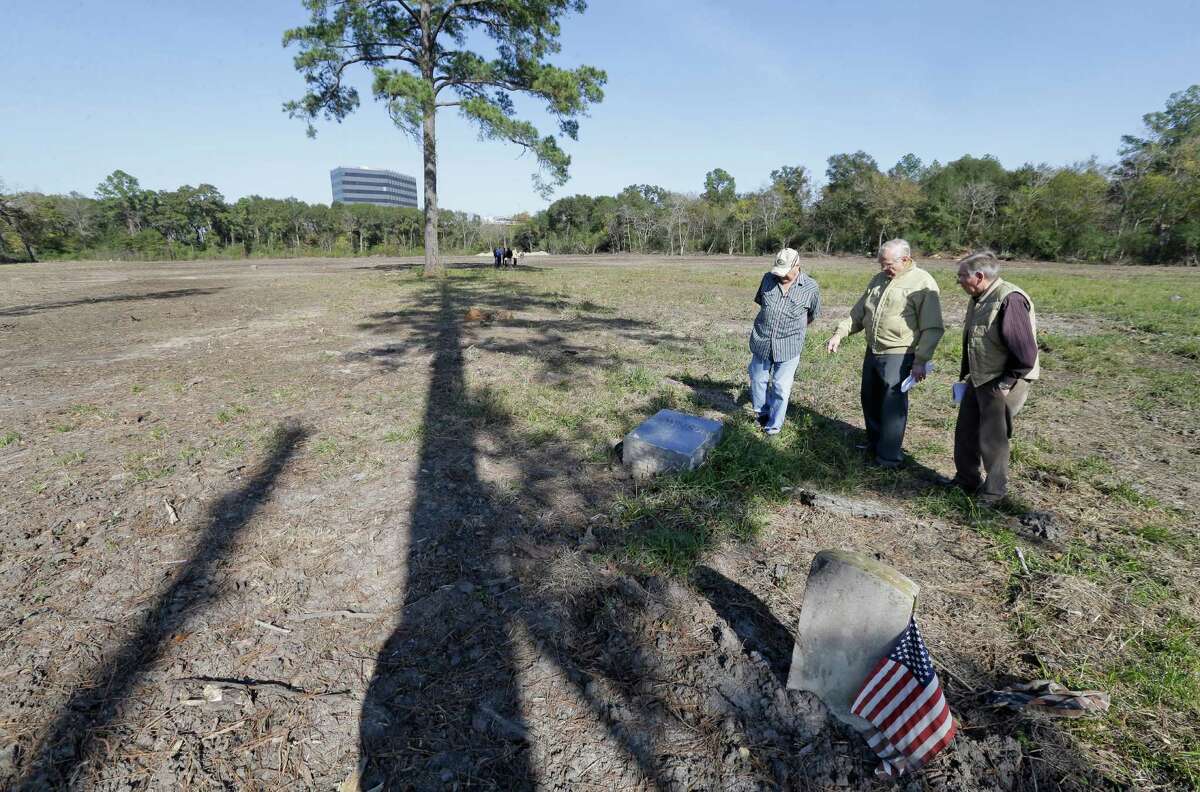 From left, Frank Price, Alfred Seeliger and Edgar Reeves talk about the desecration of graves in Aldine Cemetery. In addition to damaging headstones and grave markers, a crew also removed many trees.