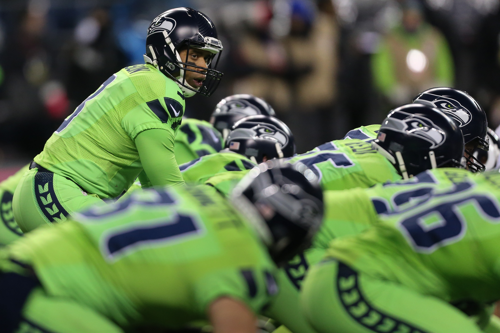 Seattle Seahawks including Thomas Rawls (34) and Cassius Marsh wear the NFL  color rush uniforms before an NFL football game against the Los Angeles  Rams, Thursday, Dec. 15, 2016, in Seattle. (AP