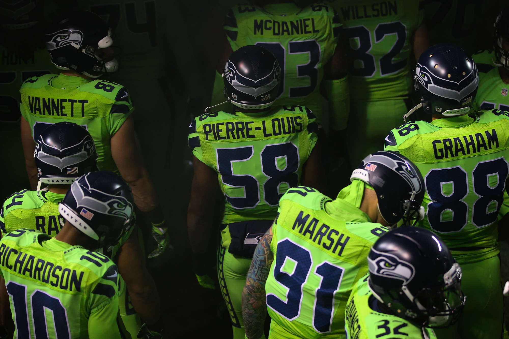Seattle Seahawks including Thomas Rawls (34) and Cassius Marsh wear the NFL  color rush uniforms before an NFL football game against the Los Angeles  Rams, Thursday, Dec. 15, 2016, in Seattle. (AP
