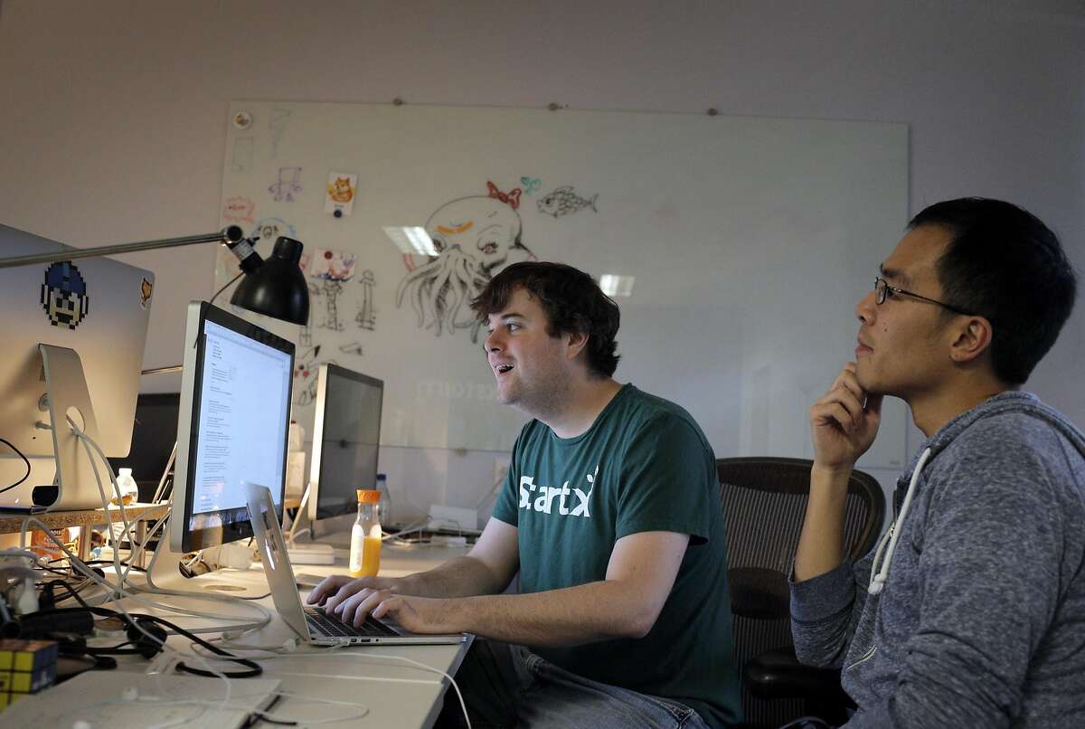 Jimmy Griffith, Studio Head, left, works with Raymond Yang, Community Manager, right, on EverWing at the Blackstorm headquarters in Mountain View, Calif., on Wednesday, December 14, 2016. Mountain View-based Blackstorm creates software that it licenses to companies so that the firms can embed their apps within other popular apps like Facebook, without having consumers download an additional separate app though a cumbersome process through the Apple App or Google Play stores.