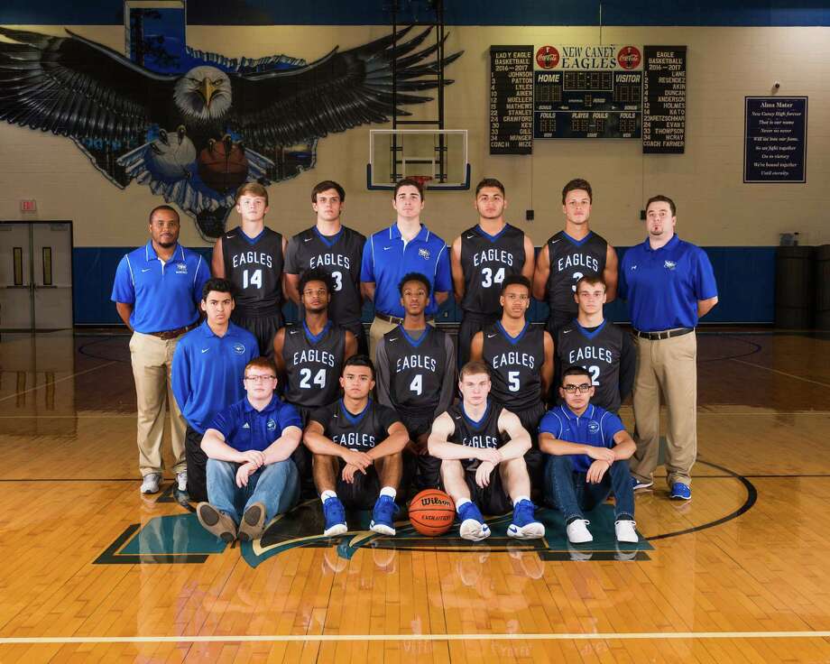 pictured is the new caney varsity basketball team.