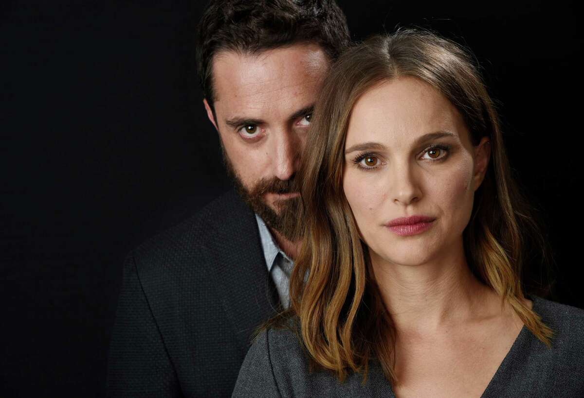 In this Nov. 11, 2016 photo, director Pablo Larrain, left, and actress Natalie Portman pose for a portrait to promote the film, "Jackie" at the Four Seasons Hotel in Los Angeles. (Photo by Chris Pizzello/Invision/AP)