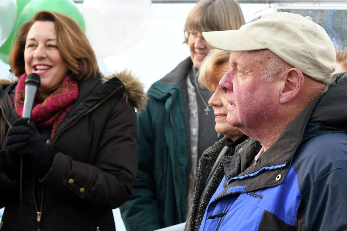Saratoga Mayor Joanne Yepsen, left, speaks as farmers Kathy Pitney and William Pitney listen during a press conference to announce the transfer of his families 166 acre farm to Pitney Meadows Community Farm Inc. on Friday Dec. 16, 2016 in Saratoga Springs, N.Y. (Michael P. Farrell/Times Union)