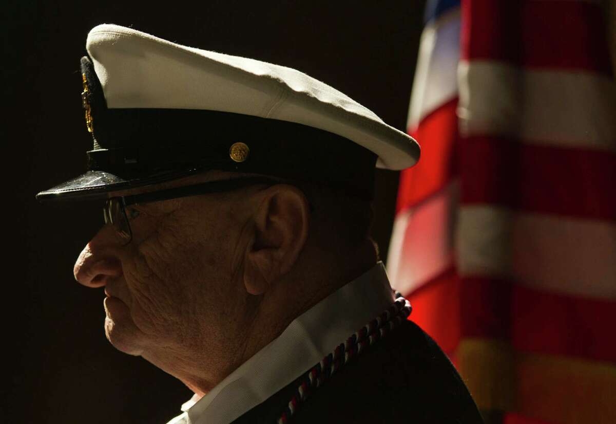 Conroe High School senior Michael Sharpe, 67, is seen in his Navy uniform before graduating from Conroe High School during Conroe ISD's mid-year commencement ceremony at Conroe High School Thursday, Dec. 15, 2016, in Conroe. Sharpe left high school at 17 and joined the Navy two years later to avoid being drafted into the Army during the Vietnam War. He retired after 22 years and worked for the U.S. Postal Service following his military career.