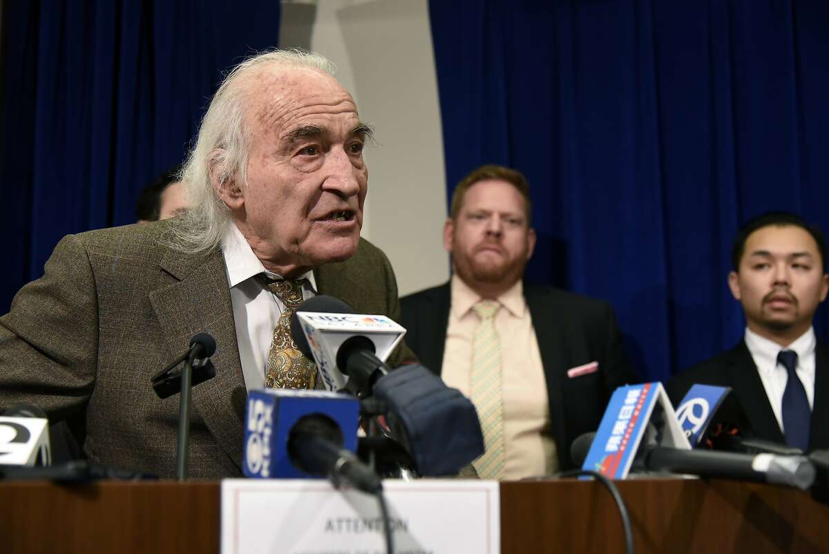 J. Tony Serra, center, lead attorney for Raymond "Shrimp Boy" Chow, speaks to the gathered media following the conviction of his client on all counts he faced, on Friday, January 8, 2016, at the Federal Building in San Francisco, CA.