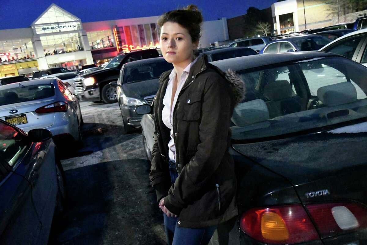 Cydney Palmatier, 20, a server at Ruby Tuesday's, stands by her car on Friday, Dec. 16, 2016, at Crossgates Mall in Guilderland, N.Y. All the Christmas gifts she bought with waitressing money for her family were stolen on Sunday when a thief broke a window and stole the presents. (Cindy Schultz / Times Union)