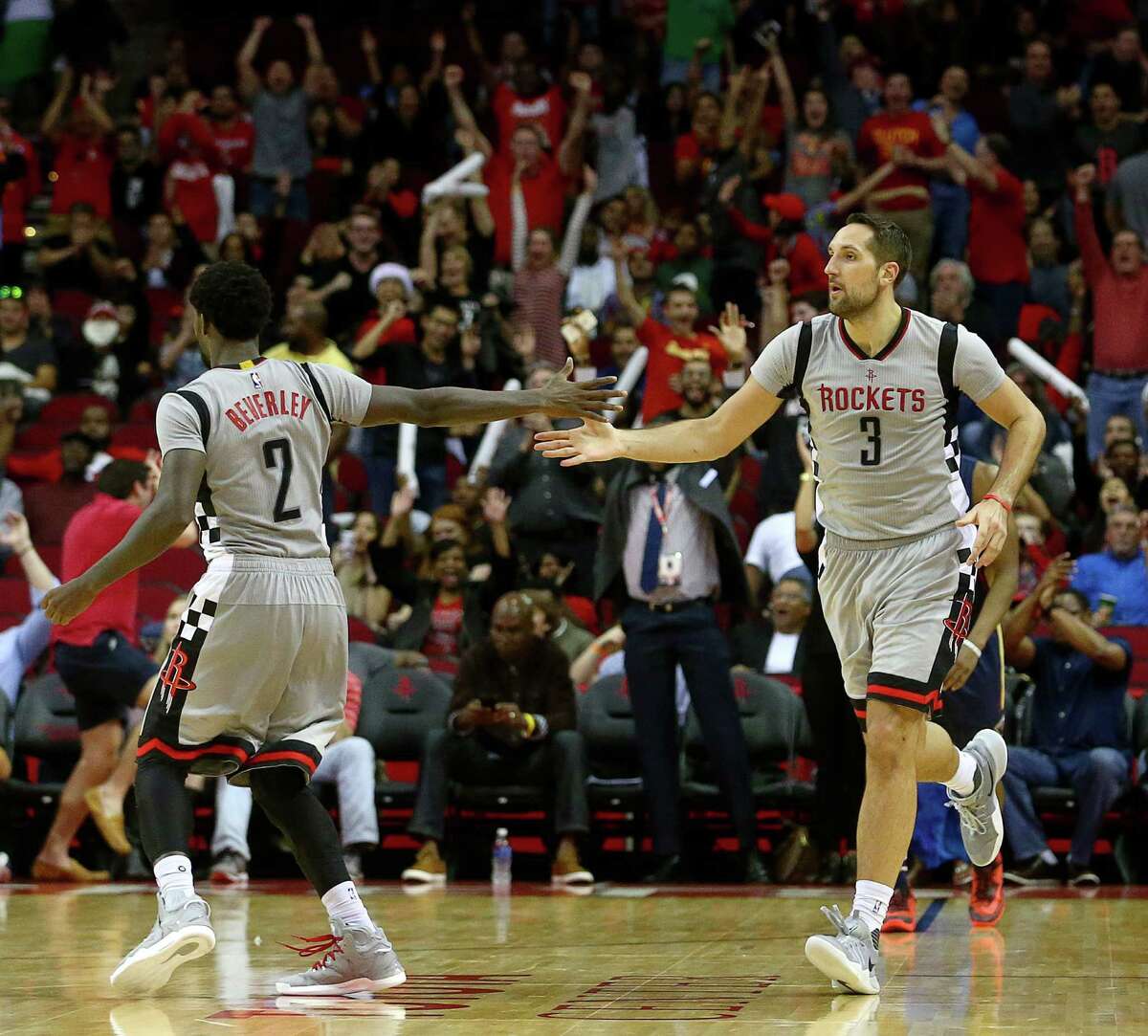 Rockets forward Ryan Anderson, right, celebrates with guard Pat Beverley after making a 3-point shot. Anderson had two of the Rockets' NBA-record 24 3-pointers on 61 attempts in the win over the Pelicans.