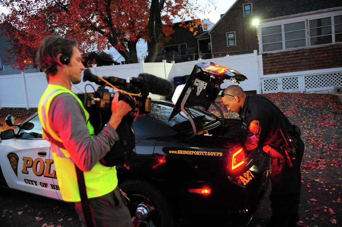 Crews from LivePD, a new reality show from A&E, patrol with members of the Bridgeport Police Department in Bridgeport, Conn. on Thursday Nov. 3, 2016.