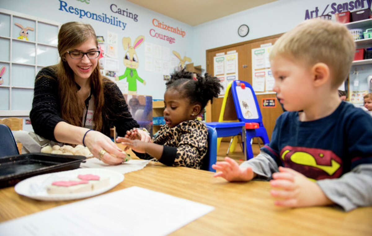 Photo provided by Mike Randolph | SVSU SVSU student Crystal Swanson, an elementary education and early childhood double major from Frankenmuth, interacts with children from Growing Years Christian School and Child Care Center in Saginaw Township.