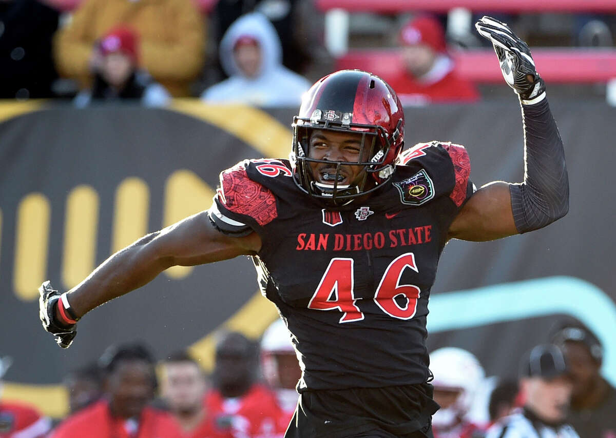San Diego State defensive lineman Jay Henderson (46) reacts after sacking Houston quarterback Greg Ward Jr. during the second half of the Las Vegas Bowl NCAA college football game on Saturday, Dec. 17, 2016, in Las Vegas. San Diego State won 34-10. (AP Photo/David Becker)