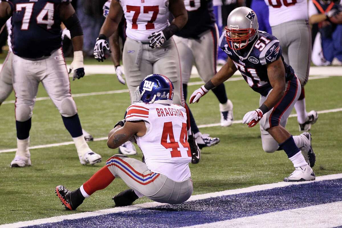 INDIANAPOLIS, IN - FEBRUARY 05: Runningback Ahmad Bradshaw #44 of the New York Giants runs the ball for a 6 yard touchdown in the fourth quarter against the New England Patriots during Super Bowl XLVI at Lucas Oil Stadium on February 5, 2012 in Indianapolis, Indiana. (Photo by Andy Lyons/Getty Images)
