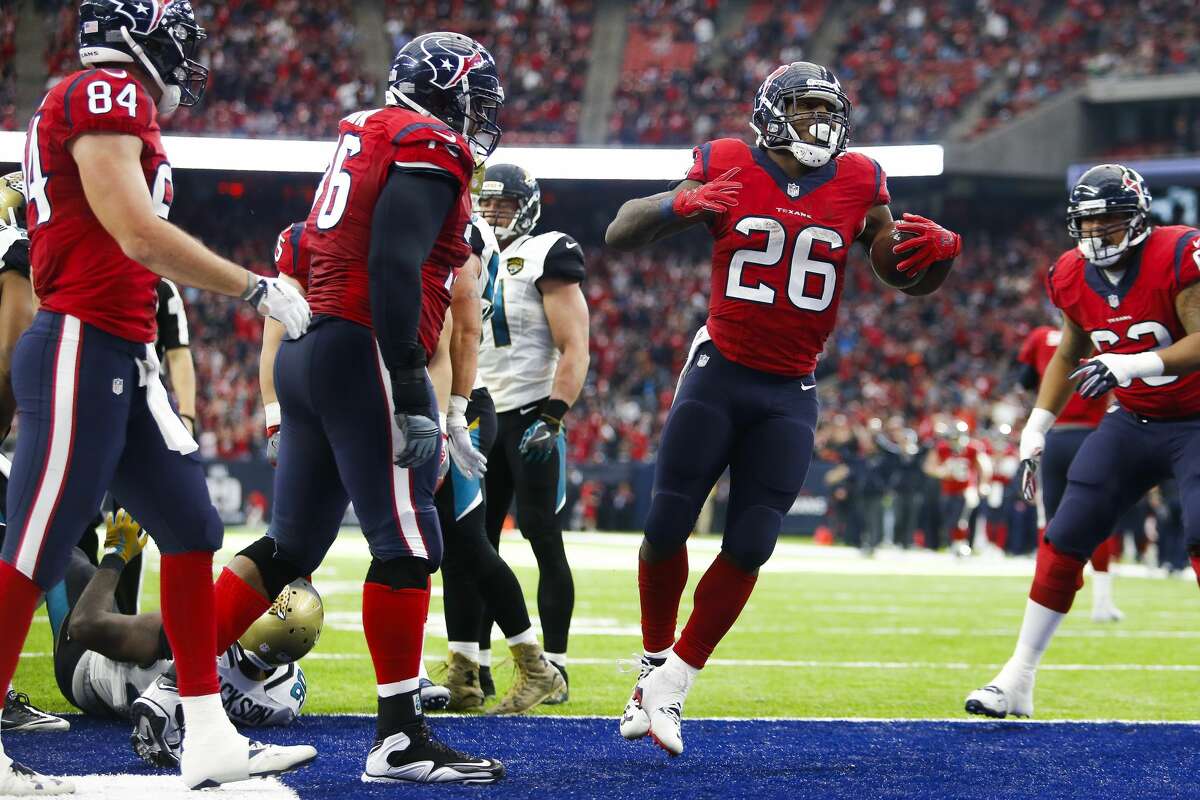 Houston Texans running back Lamar Miller (26) celebrates after running for a touchdown during the second half of the Houston Texans 21-20 win against the Jacksonville Jaguars at NRG Stadium Sunday, Dec. 18, 2016 in Houston. ( Michael Ciaglo / Houston Chronicle )
