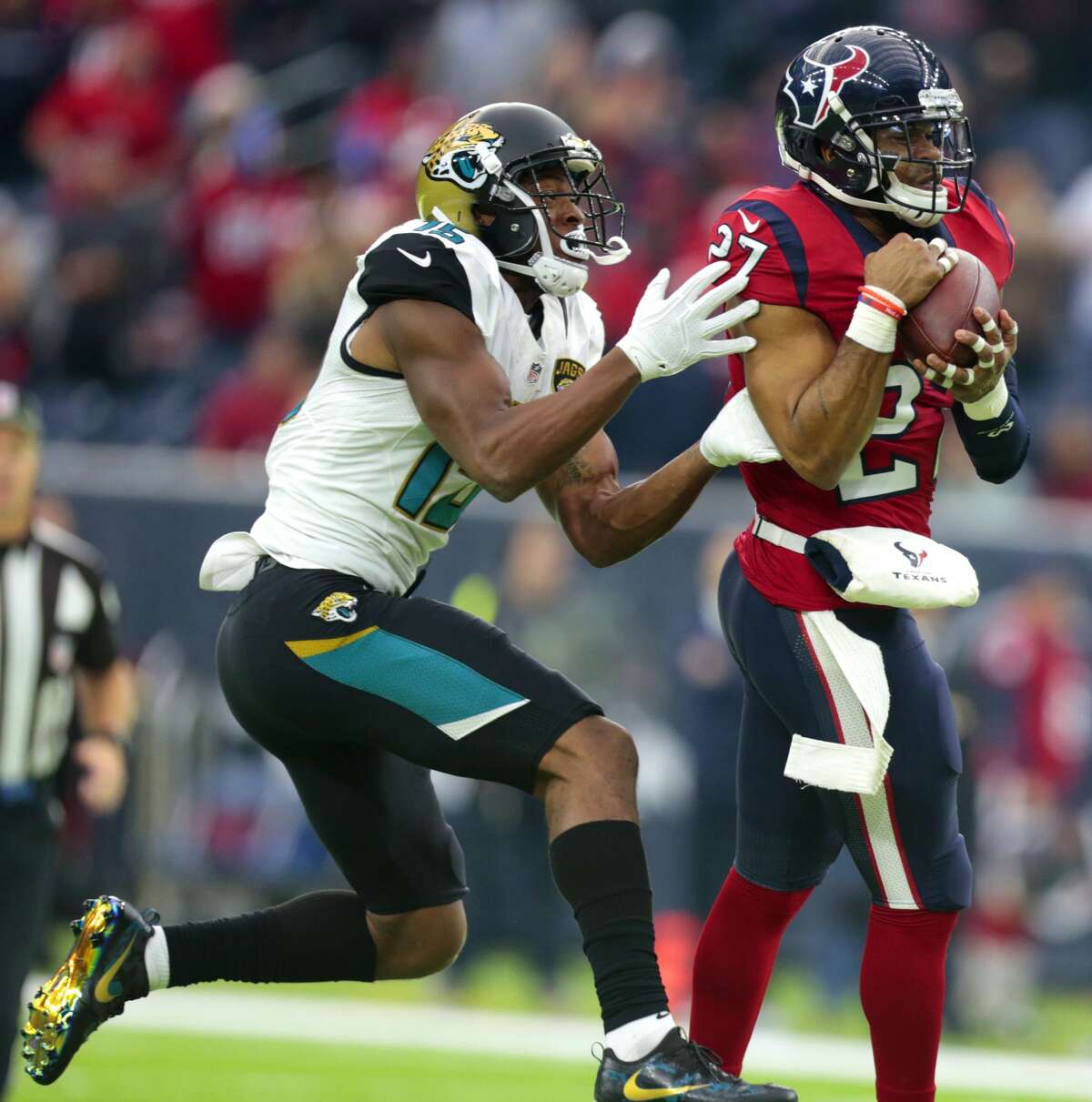 Houston Texans strong safety Quintin Demps (27) intercepts a pass intended for Jacksonville Jaguars wide receiver Allen Robinson (15) during the fourth quarter of an NFL football game at NRG Stadium on Sunday, Dec. 18, 2016, in Houston. ( Brett Coomer / Houston Chronicle )