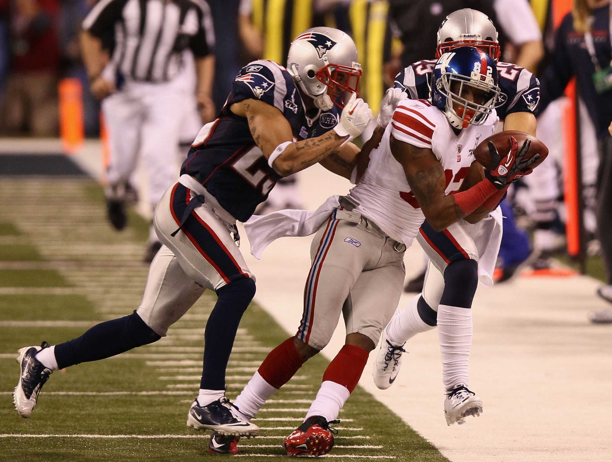 New York Giants quarterback Eli Manning goes for two points after leading  the Giants on game winning drive against the New England Patriots late in  the fourth quarter at Super Bowl XLVI