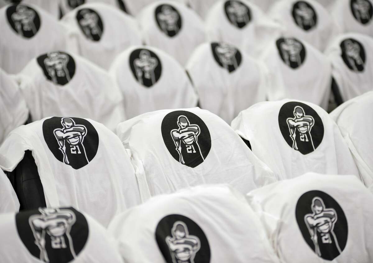 Shirts honoring San Antonio Spurs forward Tim Duncan are set out for fans on seats in the AT&T Center before an NBA basketball game against the New Orleans Pelicans, Sunday, Dec. 18, 2016, in San Antonio. (AP Photo/Darren Abate)