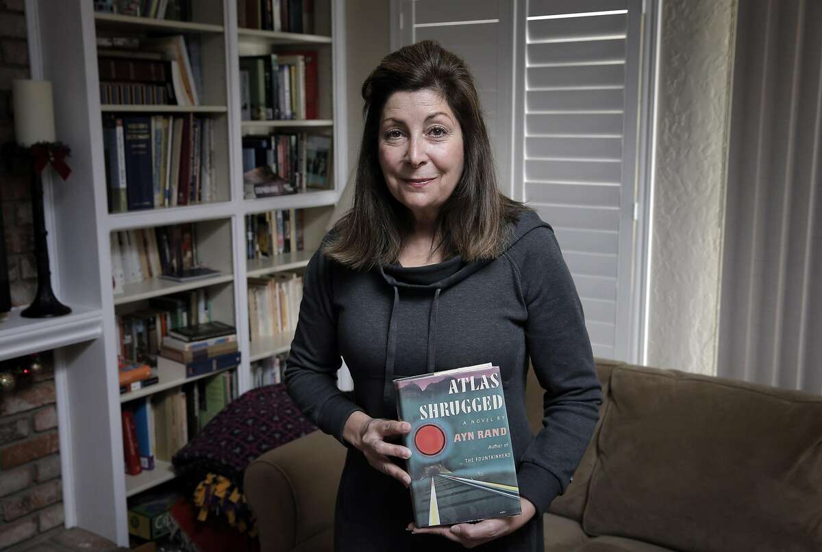 Joanne Hall holds a first edition copy of Atlas Shrugged by Ayn Rand she borrowed in 1983 from the San Francisco Public Library in her home in Pleasanton, Calif., on Sunday, December 18, 2016. As of that day, the book has been overdue for 12212 days since it was due in 1983. From January 3rd to February 14th of next year, the city libraries will implement a fine forgiveness policy, the first since 2009. They're hoping to recover $40,725 to $76,782 of books, DVDs and CDs that were never returned. Patrons currently owe around $300,000 in fines, but if they return those items during the six-week period, there will be no charge.