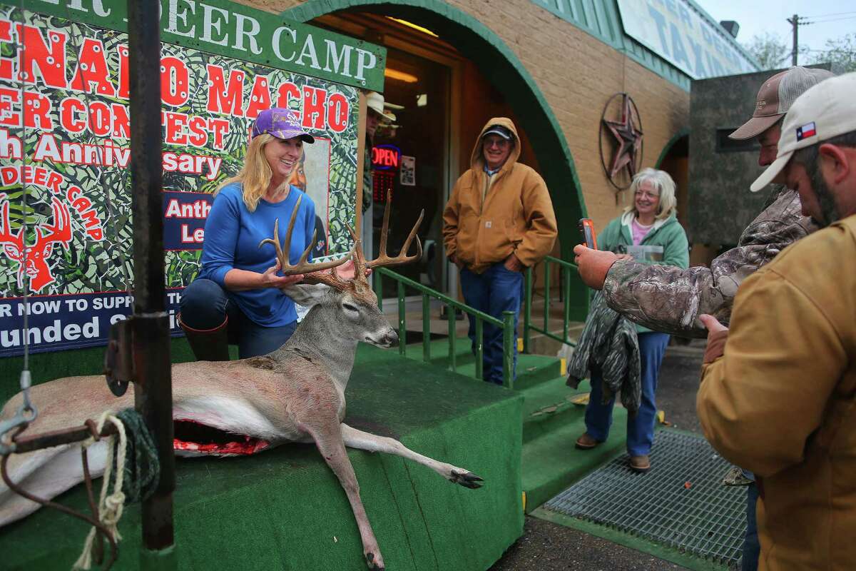 Geneva Rader, of Angelton, holds up a deer she is entering in the Freer Deer Camp's contest, Thursday, Dec. 8, 2016, in Houston. The popularity of deer hunting is a large part of the local economy around Freer. ( Mark Mulligan / Houston Chronicle )