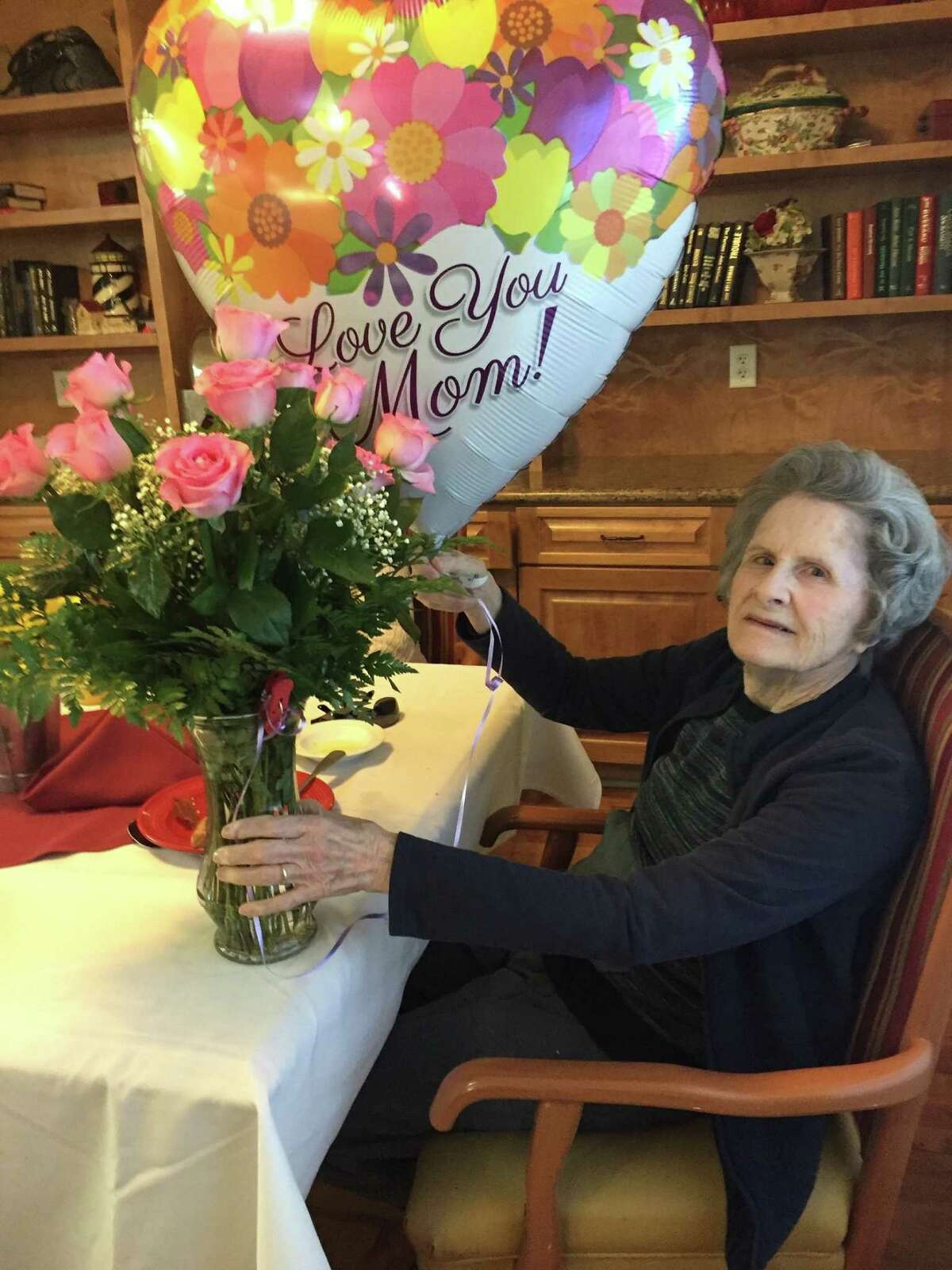 84-year-old Mary Sue Ferguson, a Parkway Place resident in the memory care area, celebrates birthday with her family at the senior living community.