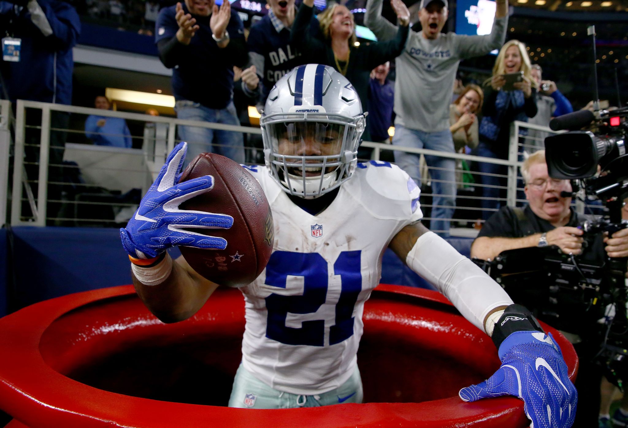 In this Aug. 9, 2018, file photo, Dallas Cowboys running back Ezekiel  Elliott (21) smiles as he …