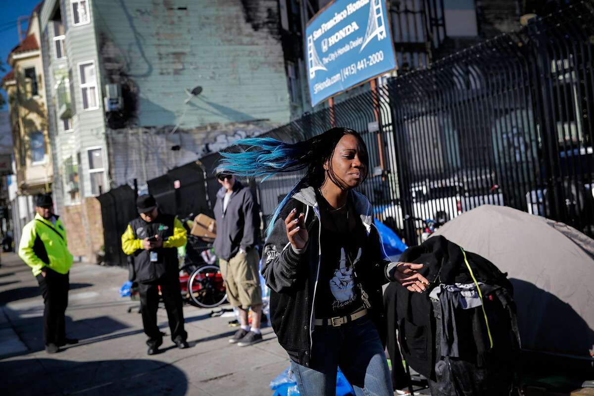 A woman named Bonny (right) gets emotional after being told that a homeless man named Tennessee was shot to death on Sunday night, in San Francisco, Calif., on Monday, Dec. 19, 2016. NOTE NOTE NOTE **** I was told by her friend that her name was Bonny - she was emotional and ran off so I cannot confirm....