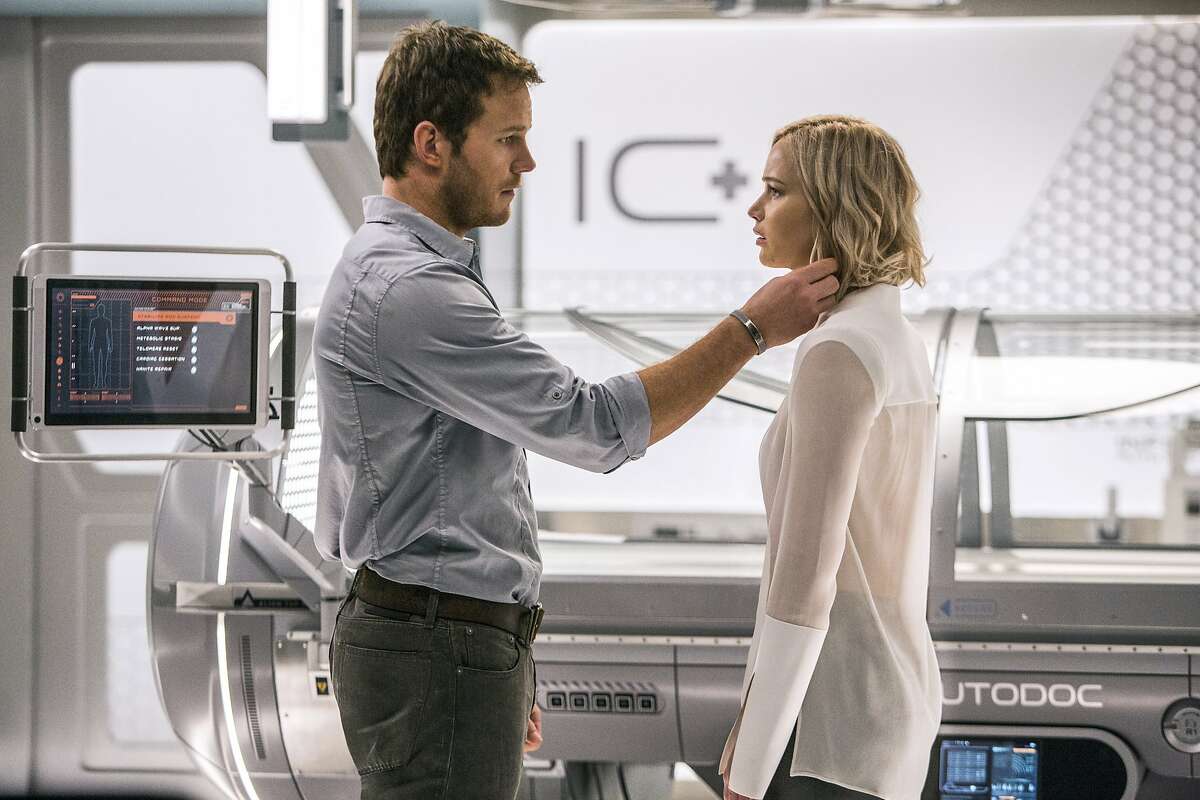 This image released by Columbia Pictures, Chris Pratt, left, and Jennifer Lawrence in a scene from the film, Passengers." (Jaimie Trueblood/Columbia Pictures/Sony via AP)