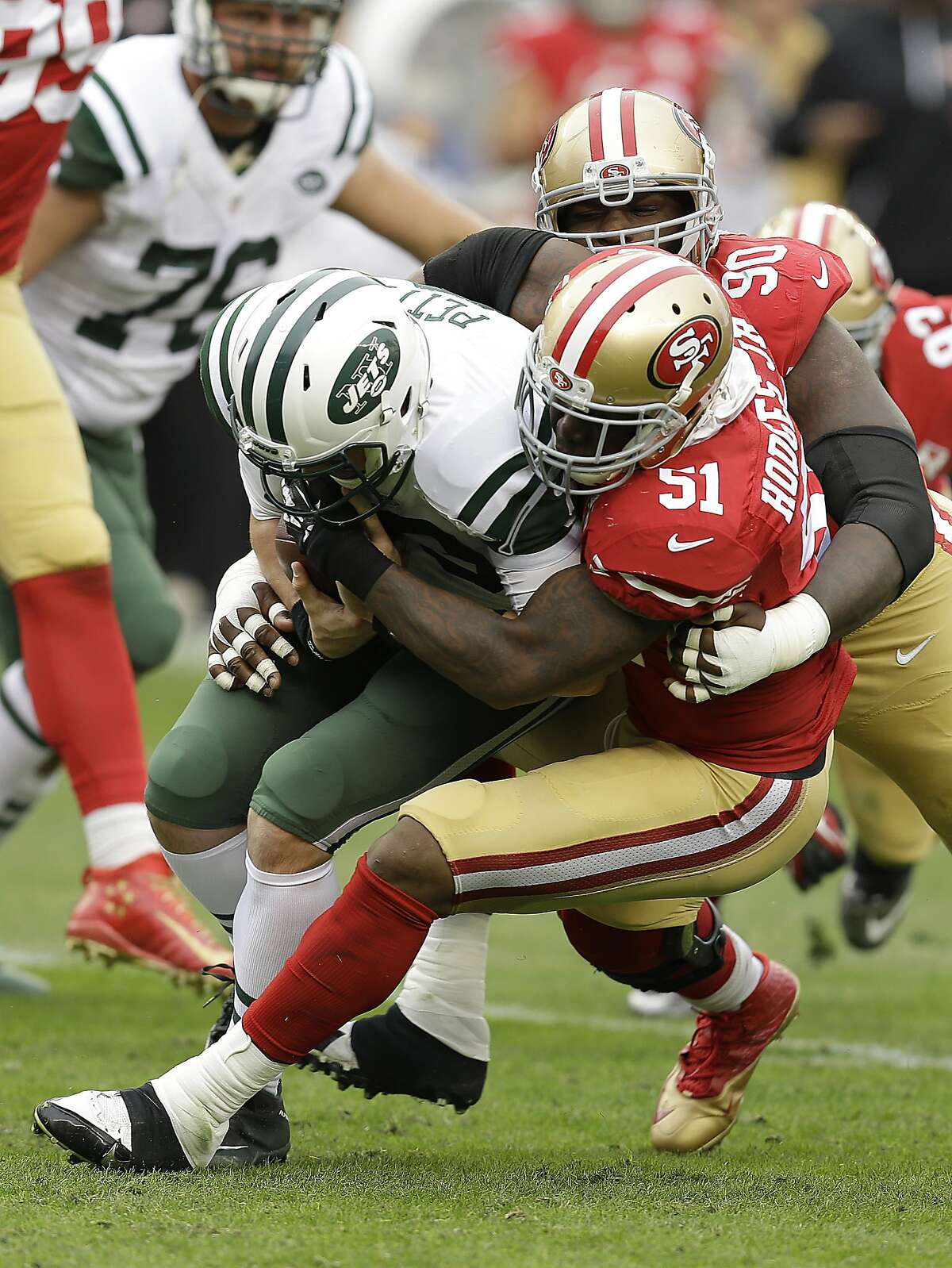 New York Jets quarterback Bryce Petty (9) is sacked by San Francisco 49ers middle linebacker Gerald Hodges (51) and linebacker Ahmad Brooks, not pictured, as nose tackle Glenn Dorsey (90) follows the play during the first half of an NFL football game in Santa Clara, Calif., Sunday, Dec. 11, 2016. (AP Photo/Ben Margot)
