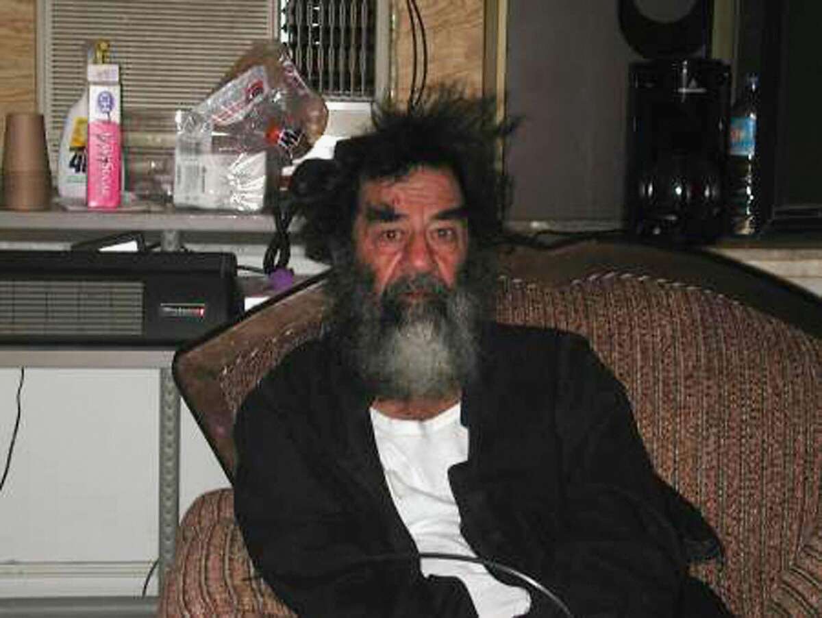IRAQ - DECEMBER 13: This unsourced picture alleges to show Iraqi leader Saddam Hussein in an unknown location in Iraq after his capture by US troops on December 13, 2003 from an underground hole on a farm in the village of ad-Dawr, near his hometown of Tikrit in northern Iraq.  (Photo by Getty Images)