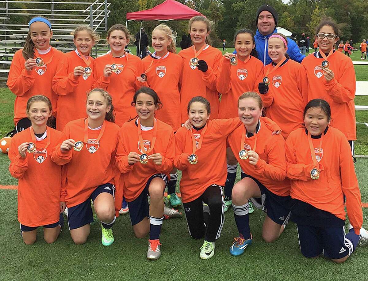 The Wilton Girls 2004 Blue team came in first place in their age group at the SCOR Columbus Day tournament. The team outscored their opponents 5-0. Team members include: Bottom row, from left, Mia Cawley, Olivia Newfield, Gracie Kaplan, Meredith Mobyed, Katie Umphred, and Kiana Gow, and back row, from left, Kathryn Cronin, Morgan Lebek, Kathleen Lamanna, Anabelle Creveling, Bella Andjelkovic, Akira Nobumoto, Coach Iain Golding, Ava Marini, and Jamie Leventhal.
