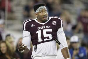 Texas A&M defensive lineman Myles Garrett (15) talks to teammates in between drills before the start of the game against Ole Miss on Nov. 12, 2016, in College Station.