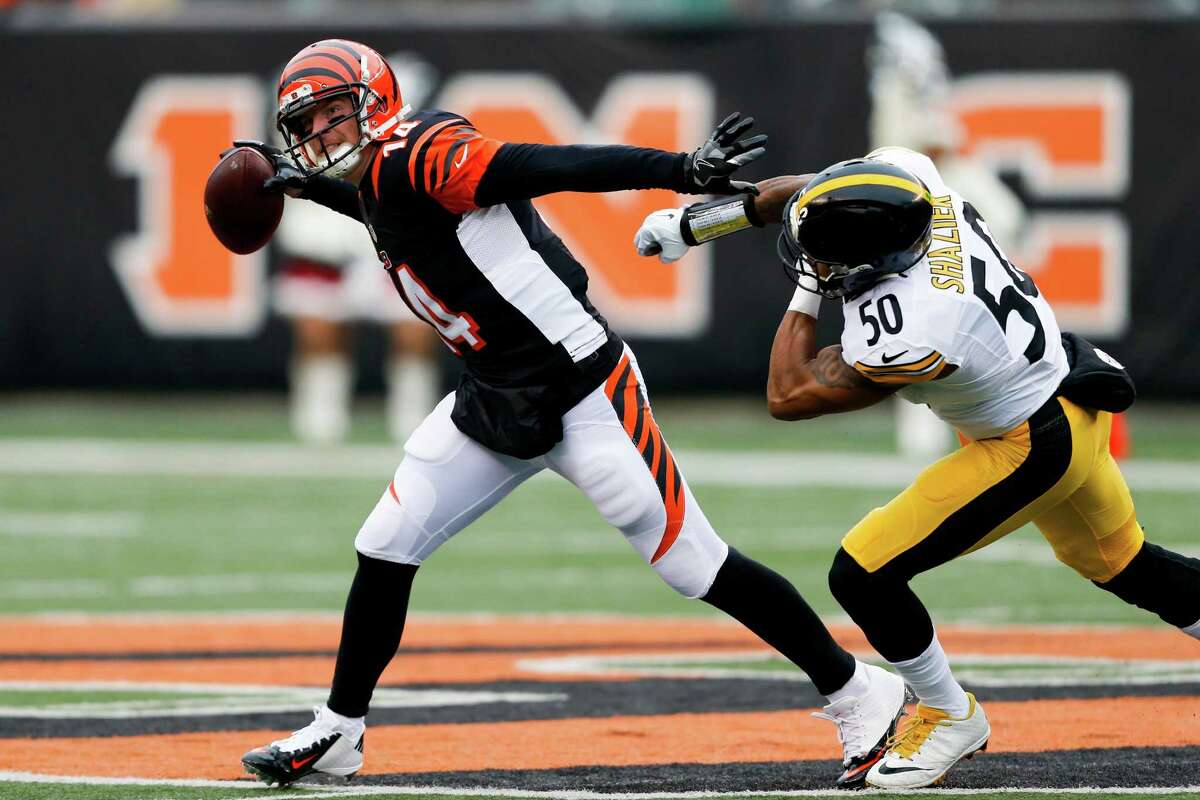 Quarterback Andy Dalton, left, has seen the Bengals' season not go according to form as they sit at 5-8-1 after making the playoffs the last five seasons.