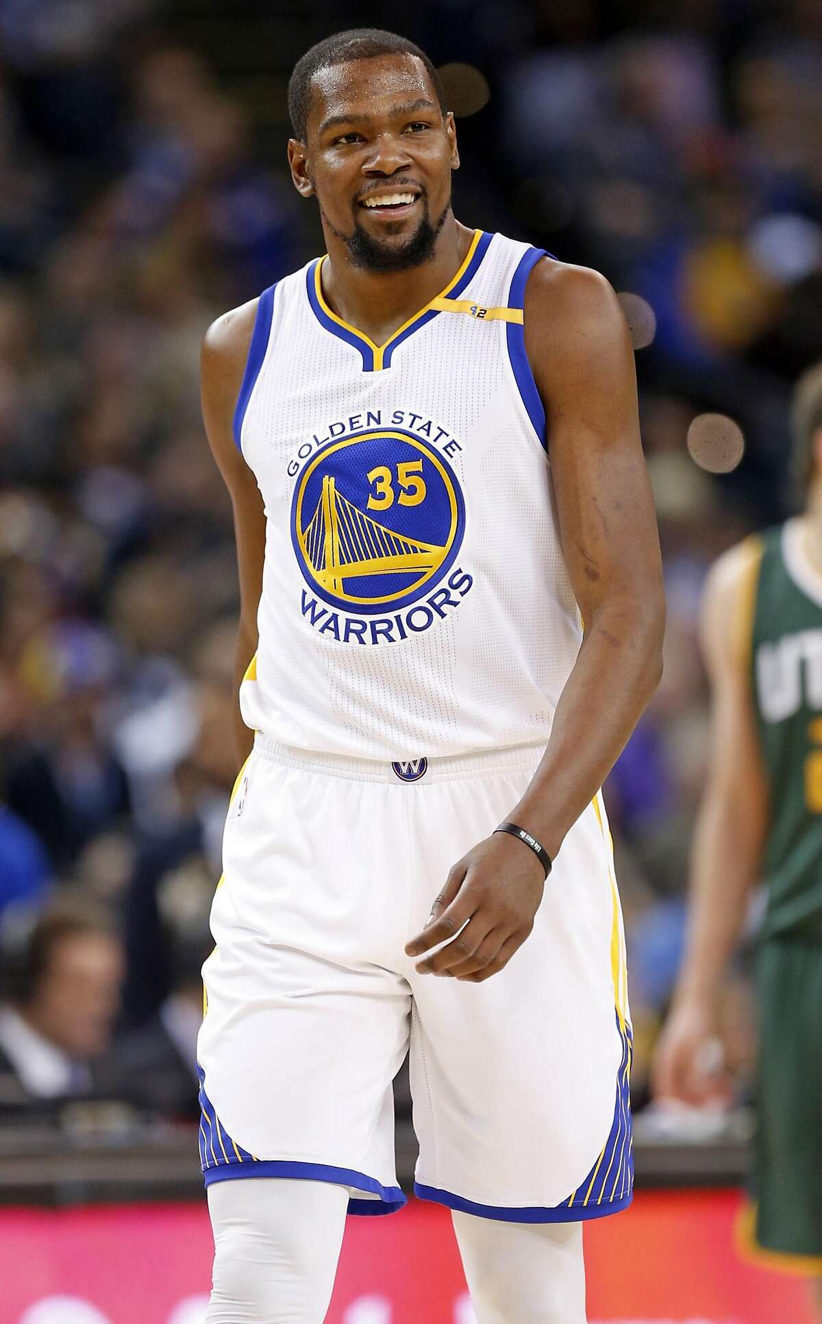 Golden State Warriors' Kevin Durant smiles in 1st quarter against Utah Jazz during NBA game at Oracle Arena in Oakland, Calif., on Tuesday, December 20, 2016.