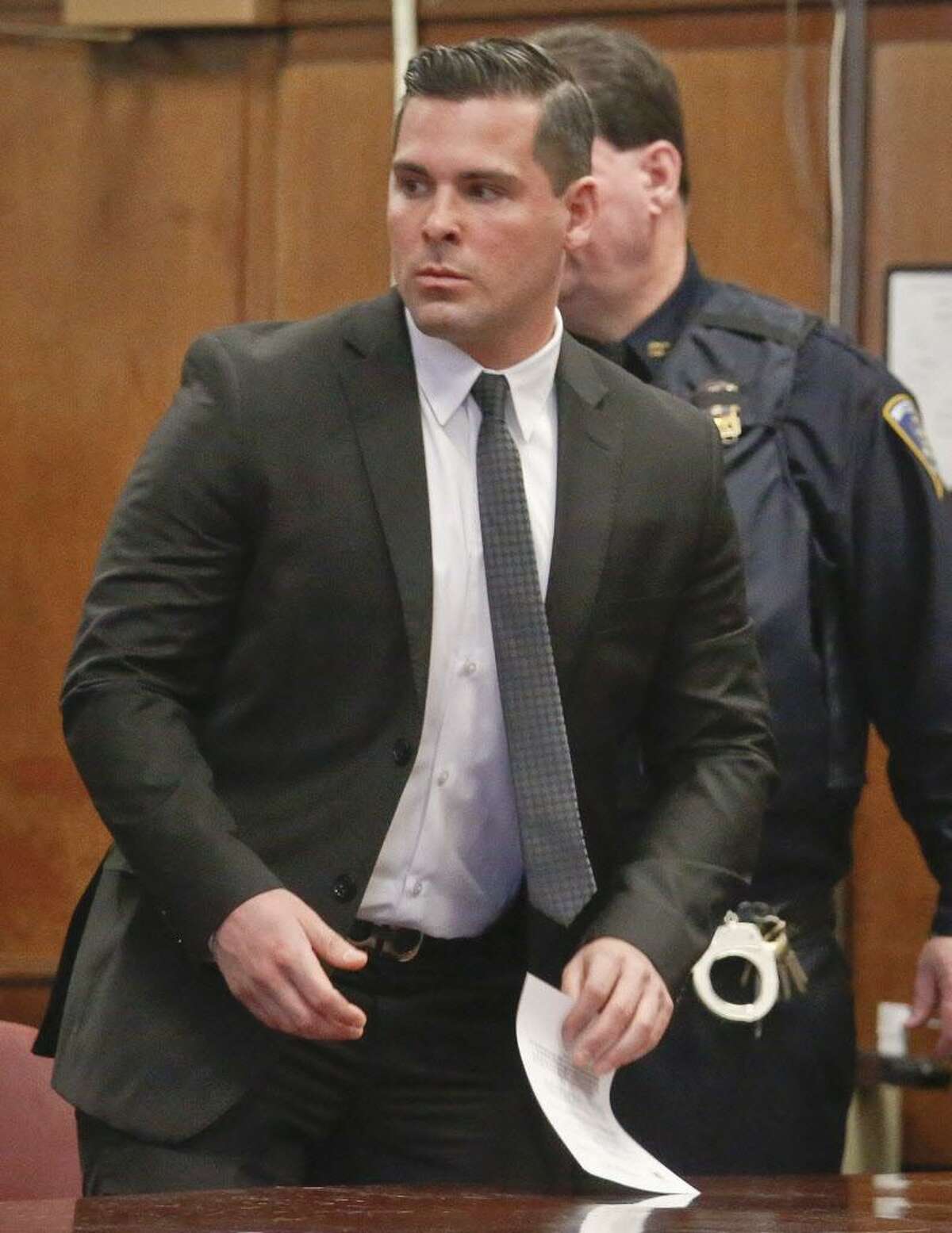 FILE — Lawrence Dilione, 28, of New Jersey, leaves after his hearing in criminal court, Tuesday Dec. 13, 2016, in New York. Dilione is charged along with James Rackover, who was charged with concealment of a human body, hindering prosecution and tampering with evidence in the stabbing death of 26-year-old Joseph Comunale from Connecticut. (AP Photo/Bebeto Matthews)